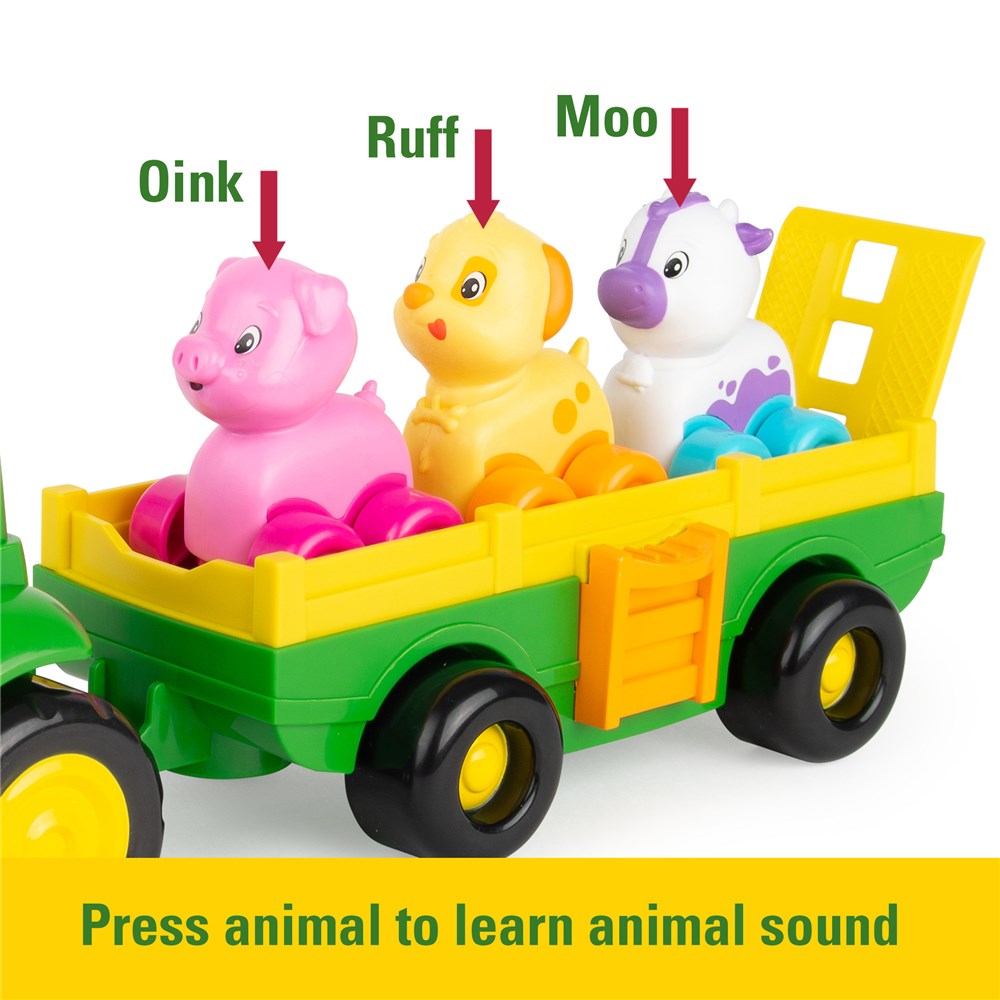 John Deere Animal Sounds Wagon Ride. Toy truck with pig, dog, and cow figurines on a white background