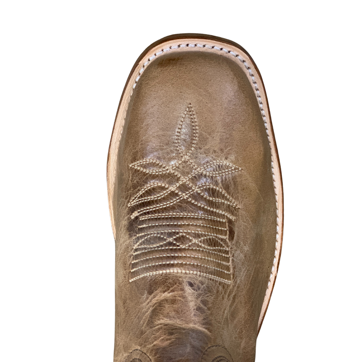 Boulet Men's Roughstock Western Boot. Close-up of a brown leather boot with intricate stitching on a white background