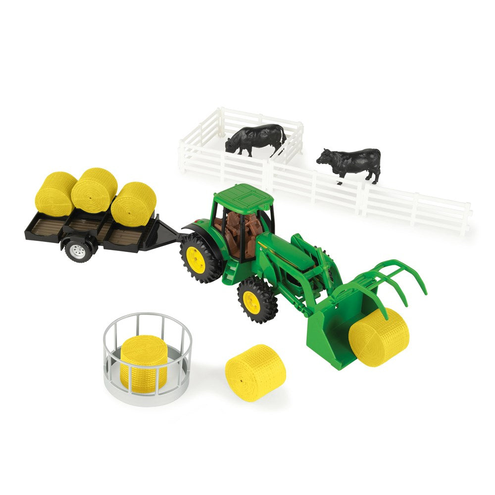 1:32 John Deere Hay Farm Set. Toy tractor with trailer and farm accessories on a white background
