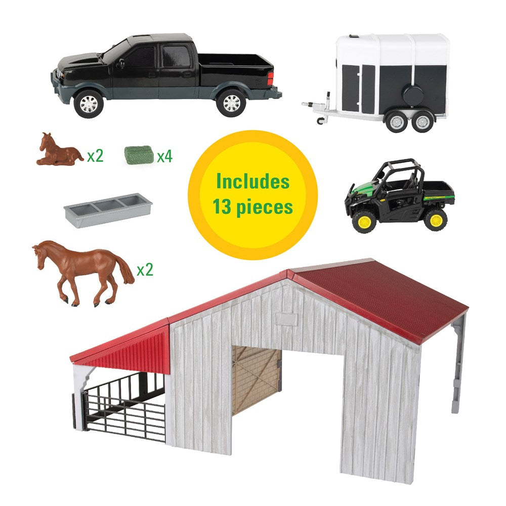 John Deere 1:32 Weathered Barn Play Set. Toy stable set with red roof, gray walls, and toy vehicles on a white background