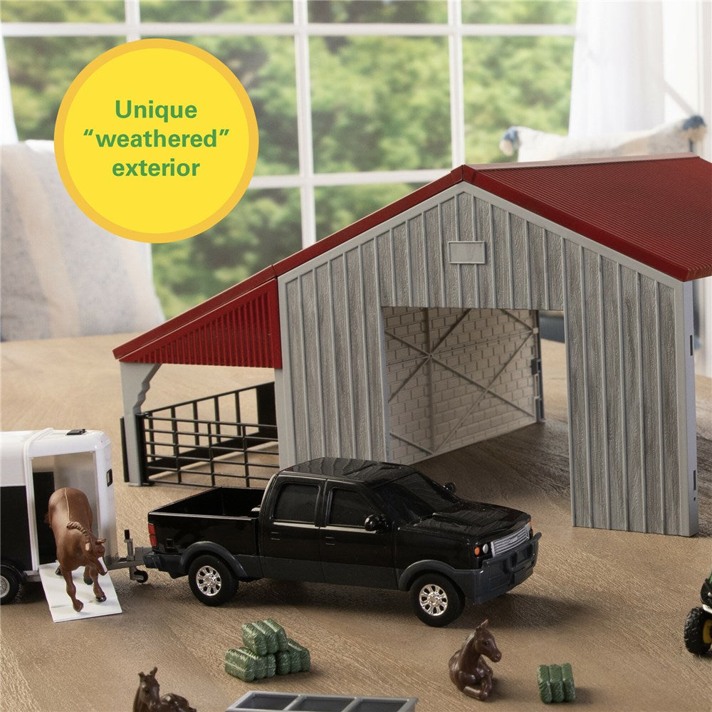 John Deere 1:32 Weathered Barn Play Set. Model farm with barn, truck, and horses in a display setting.