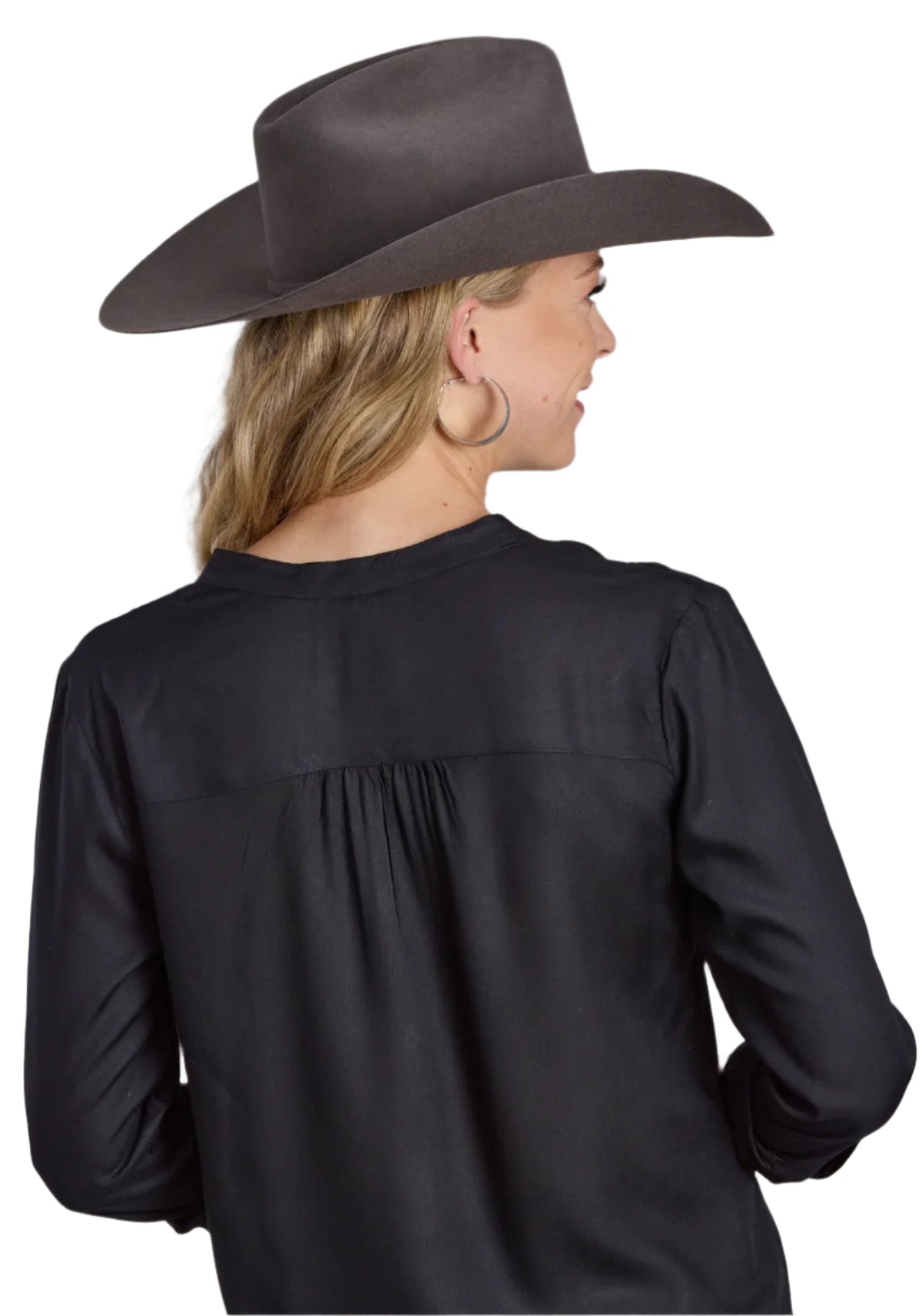 Roper Women's Studio West L/S Blouse. A woman viewed from the back wearing a black long-sleeve blouse and a gray cowboy hat.