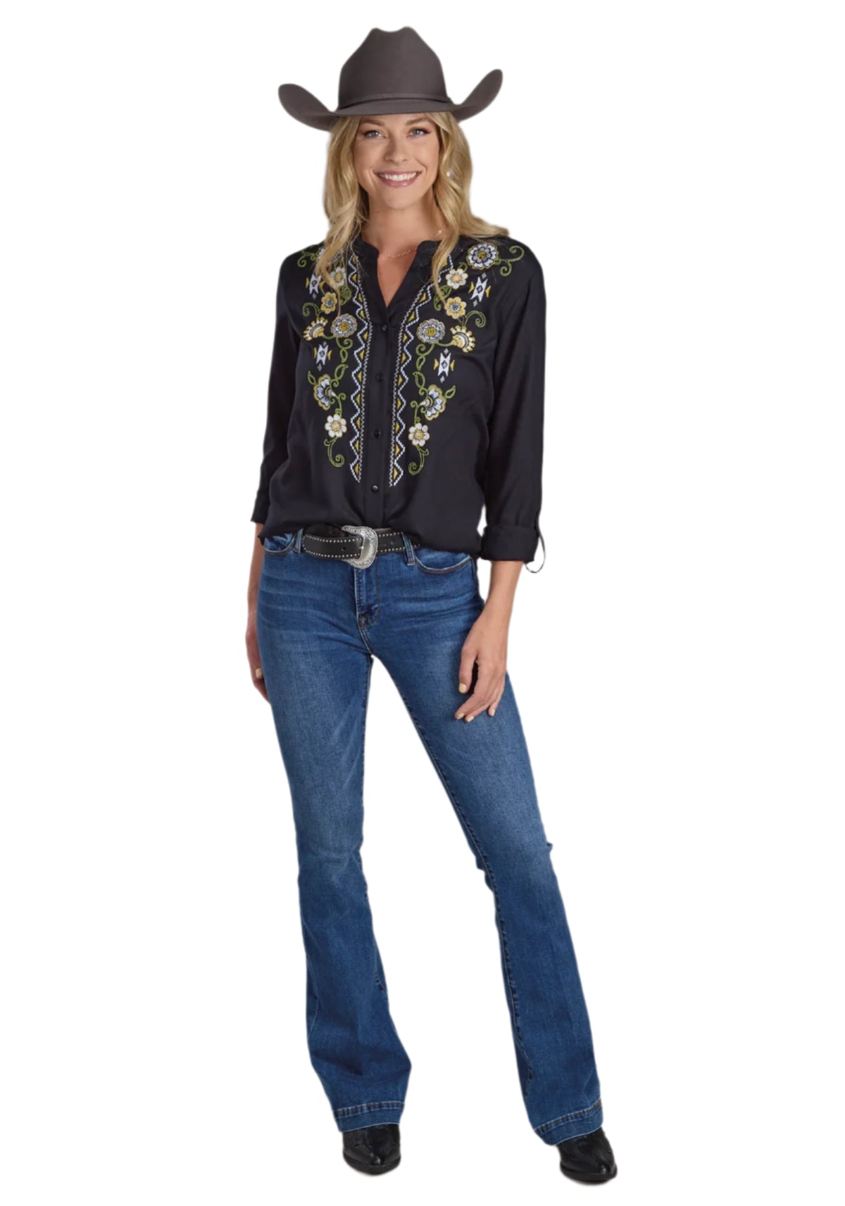 Roper Women's Studio West L/S Blouse. Woman in black embroidered shirt and blue jeans with a cowboy hat on a plain background.