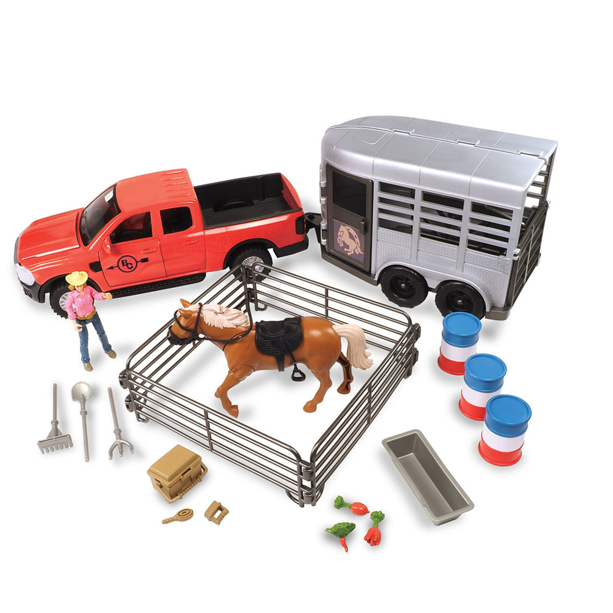 A toy horse and trailer playset on a white background, including a red pickup truck, silver horse trailer, brown horse figure, metal stable, small accessories like a cowboy figure, tools, crate, and barrel pieces.