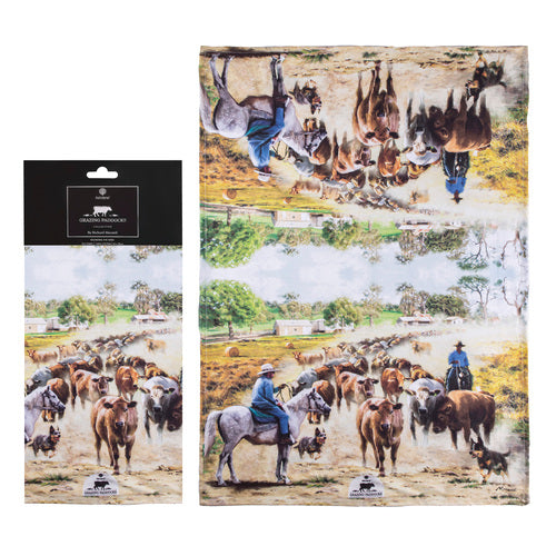 Ashdene Grazing Paddocks Kitchen Towel. Packaging and a double-sided kitchen towel featuring artwork with dairy cows and their calves in a paddock, with Australian landscape in the background.