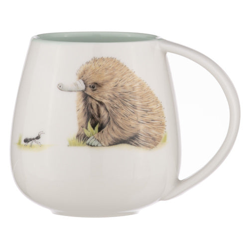 Ashdene Bush Buddies Echidna Snuggle Mug. A white ceramic mug with a 3D illustration of an echidna sitting on grass.