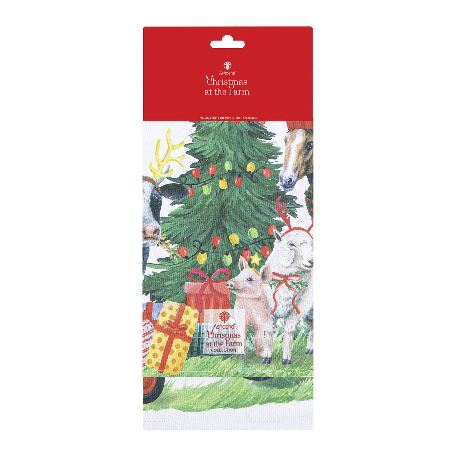 Two white kitchen towels with colorful Christmas farm illustrations, shown side by side on a white background. The left towel features a tractor, cart, and holiday trees with small animals.