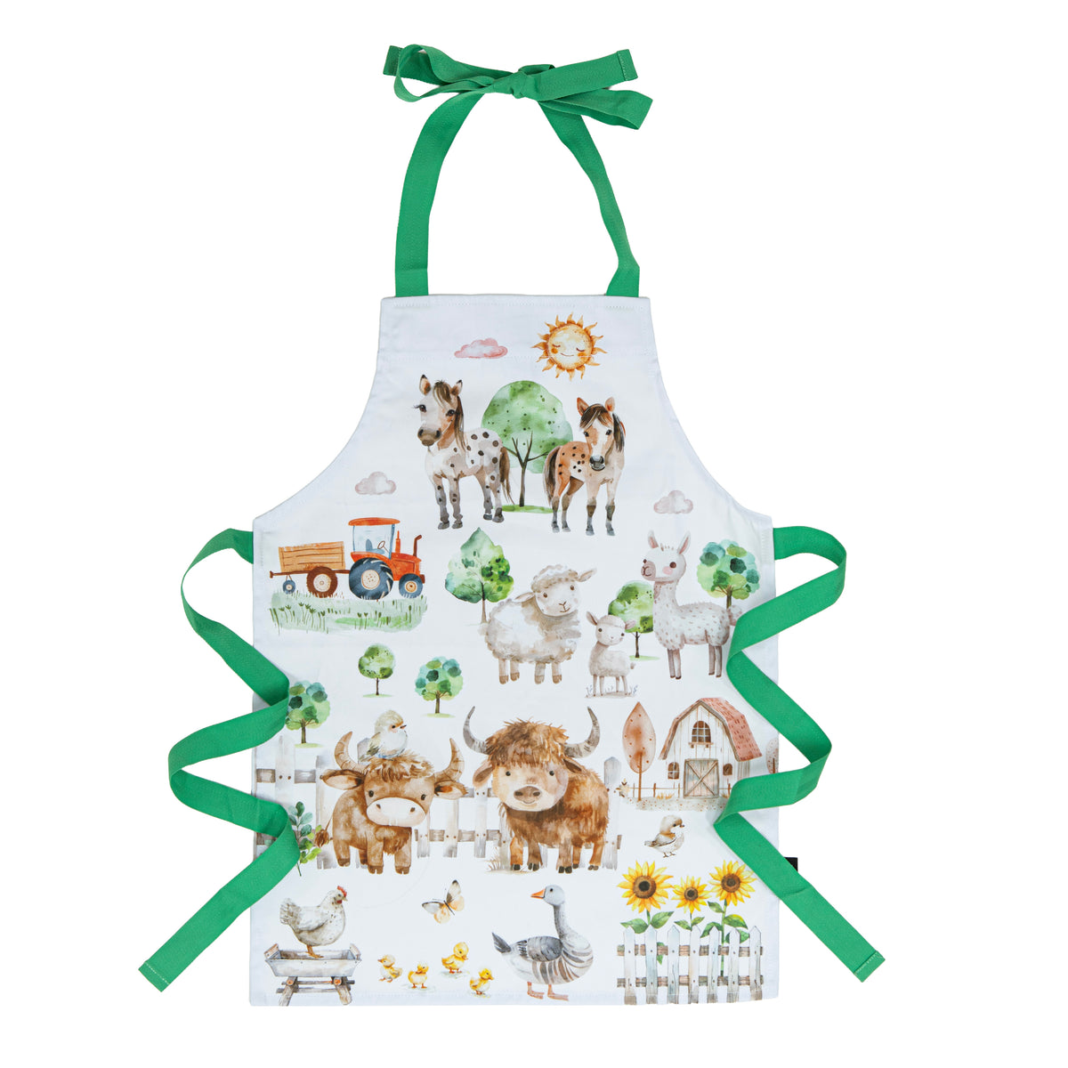 A white children's apron with green neck and waist ties, decorated with a colorful watercolor farm illustration featuring cows, sheep, a tractor, sun, and flowers.