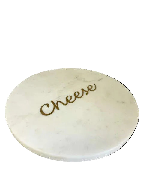 Round marble cheese board with 'Cheese' engraving on a white background