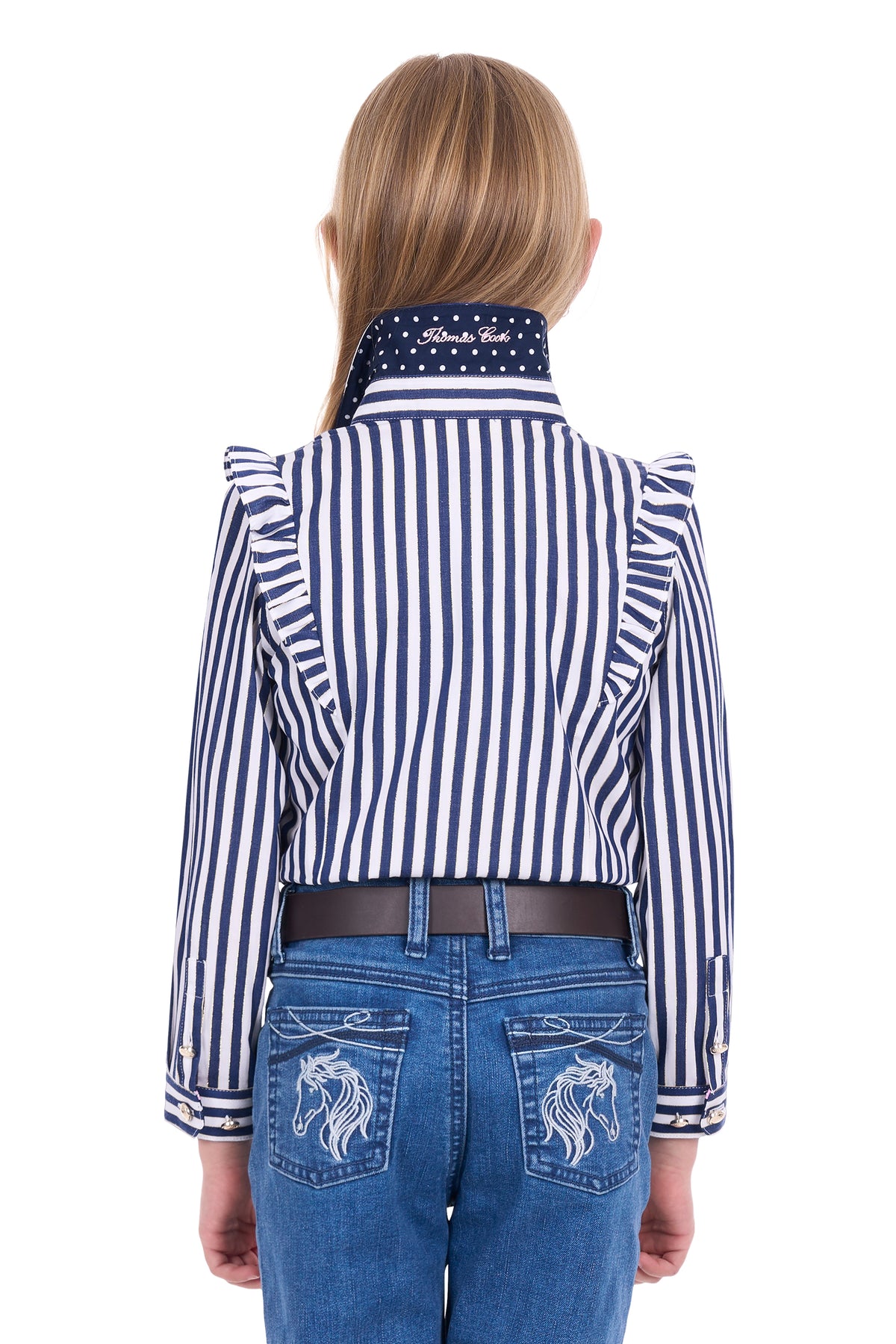 Person wearing a blue and white striped shirt with a high collar and blue jeans with horse designs.