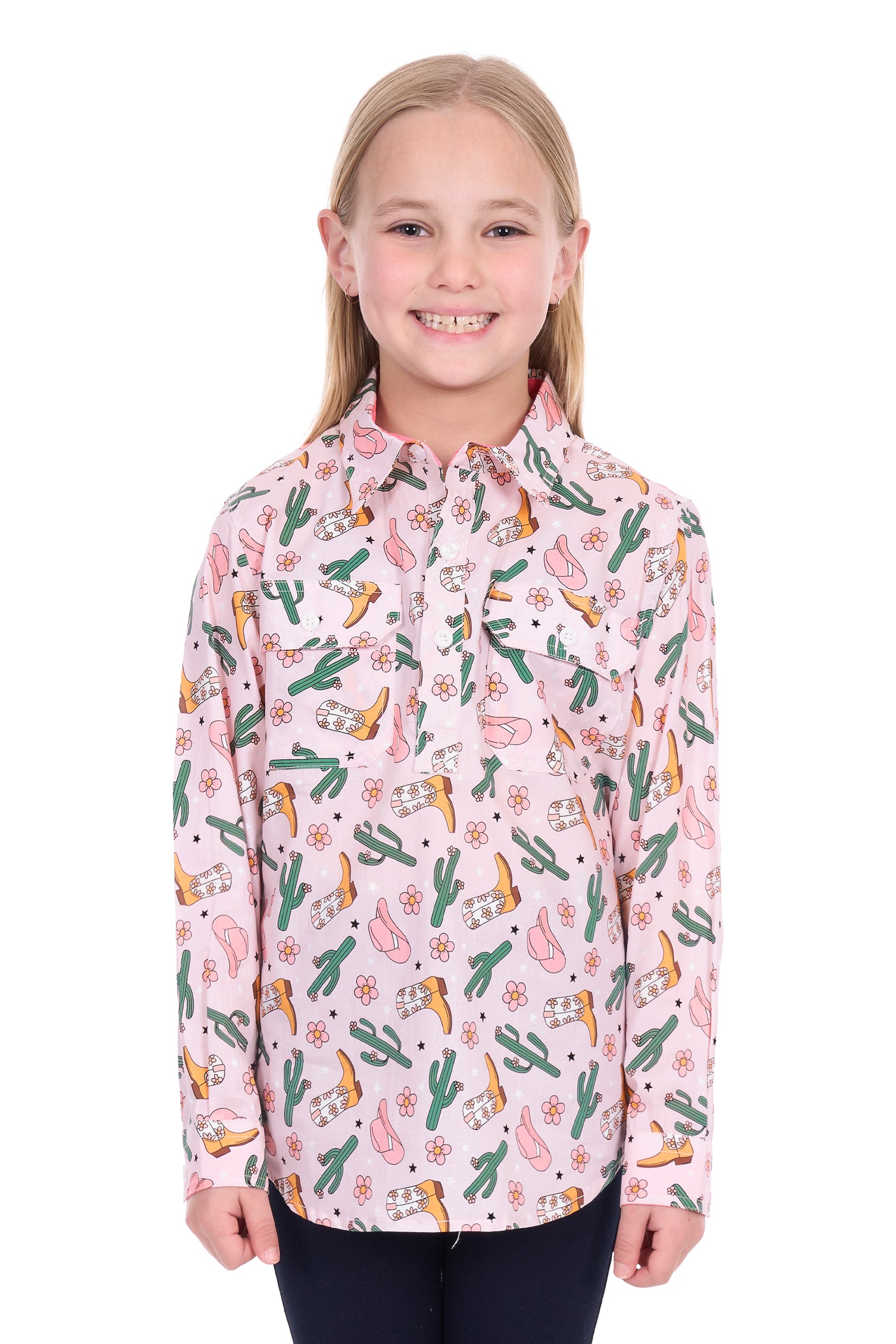 Girl wearing a pink patterned shirt with cacti and flowers on a white background