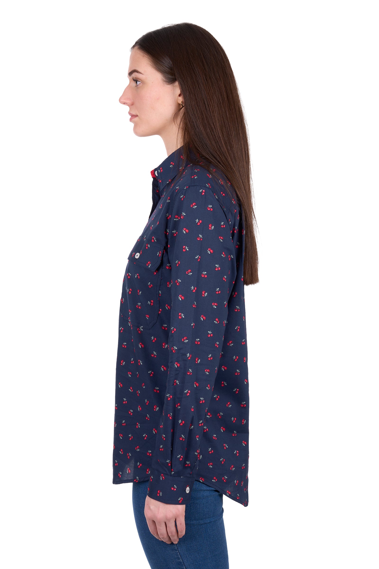 Woman wearing a navy blue floral patterned shirt on a white background