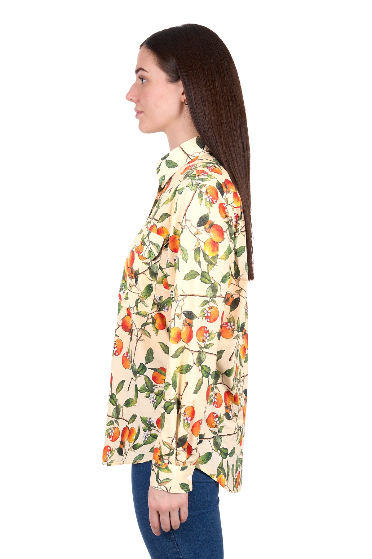 Woman wearing a floral patterned shirt on a white background