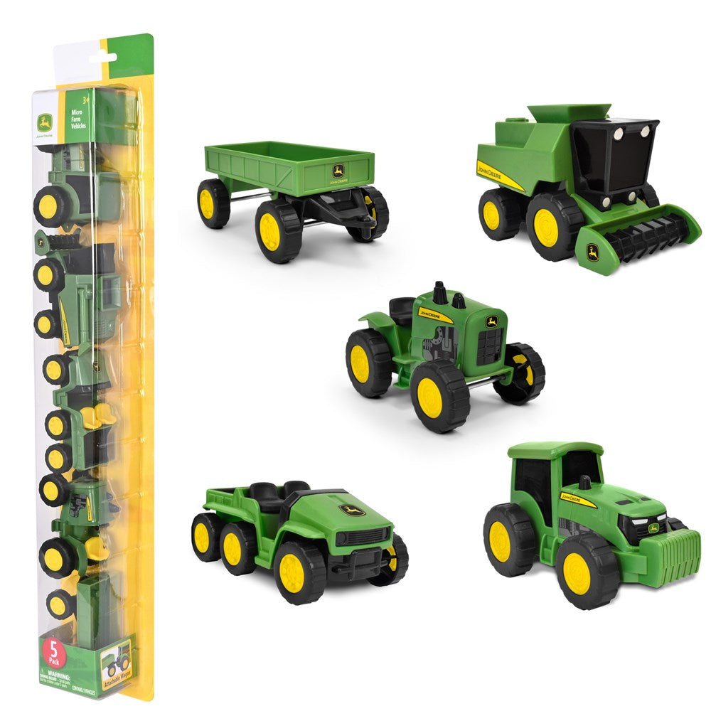 Set of John Deere toy vehicles including a tractor, trailer, and combine harvester on a white background.