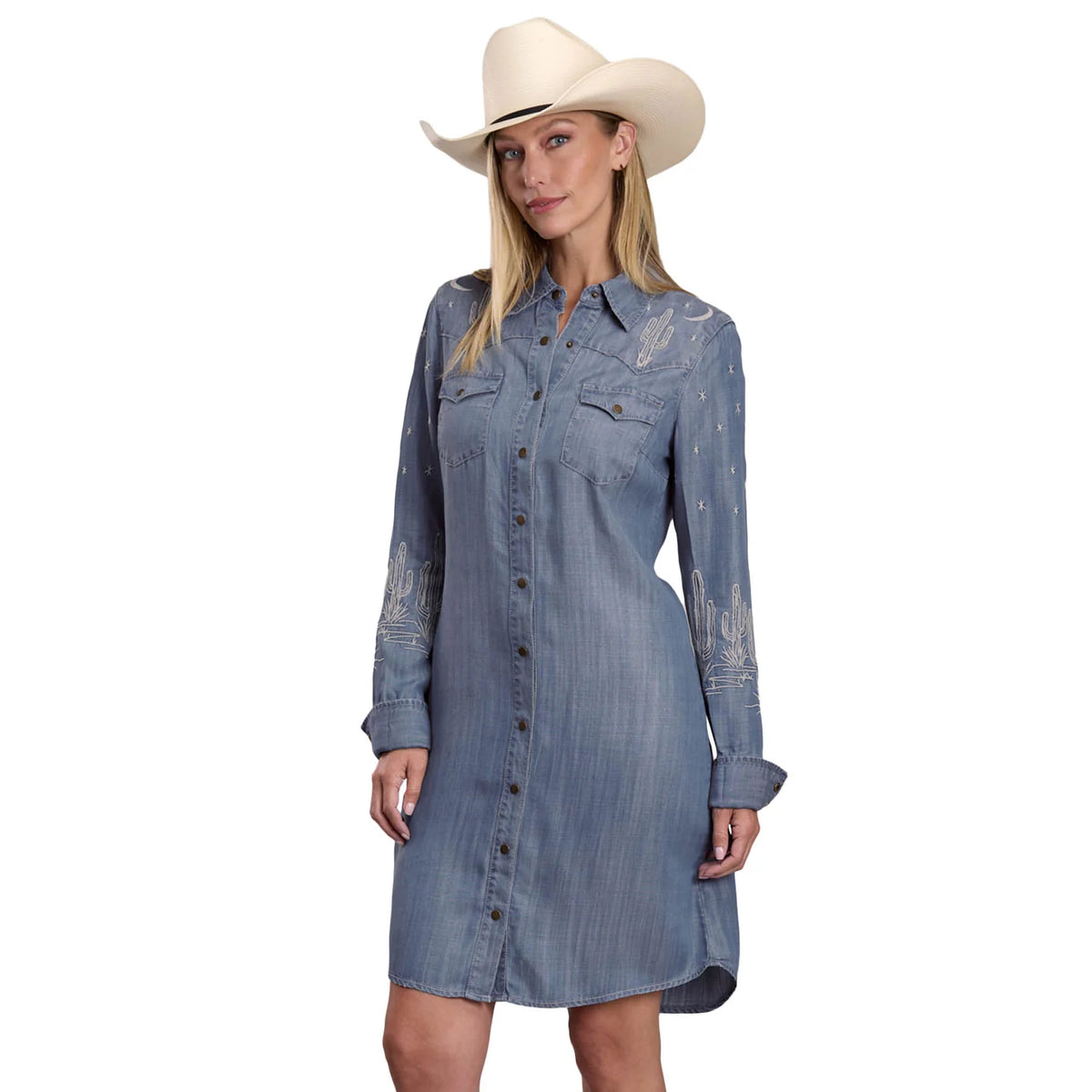 Woman wearing a blue denim dress and white cowboy hat on a white background