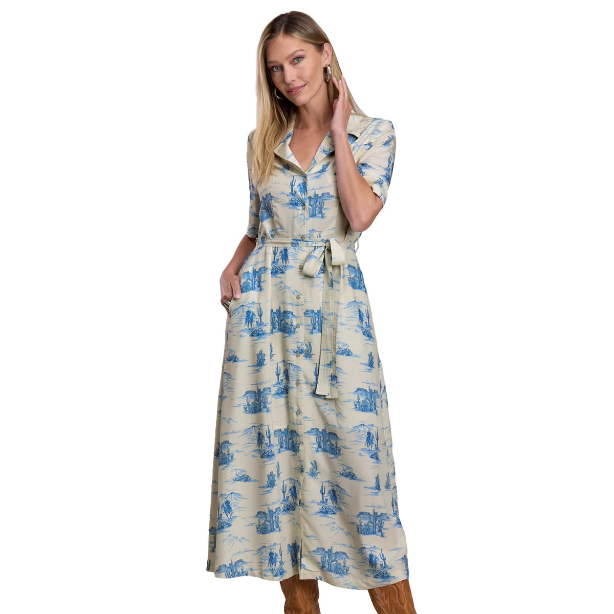 Woman wearing a blue and white patterned dress on a white background