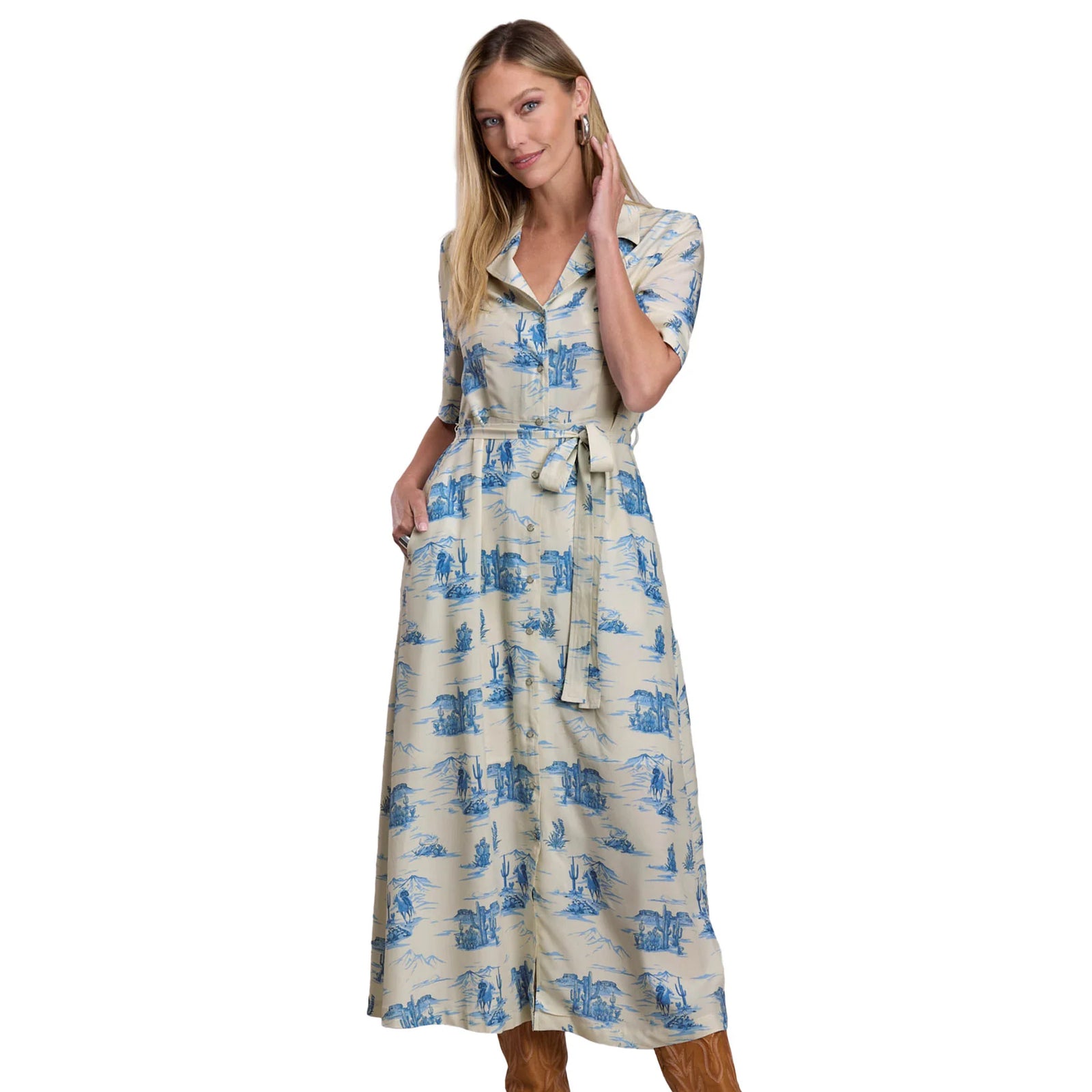 Woman wearing a blue and white patterned dress on a white background