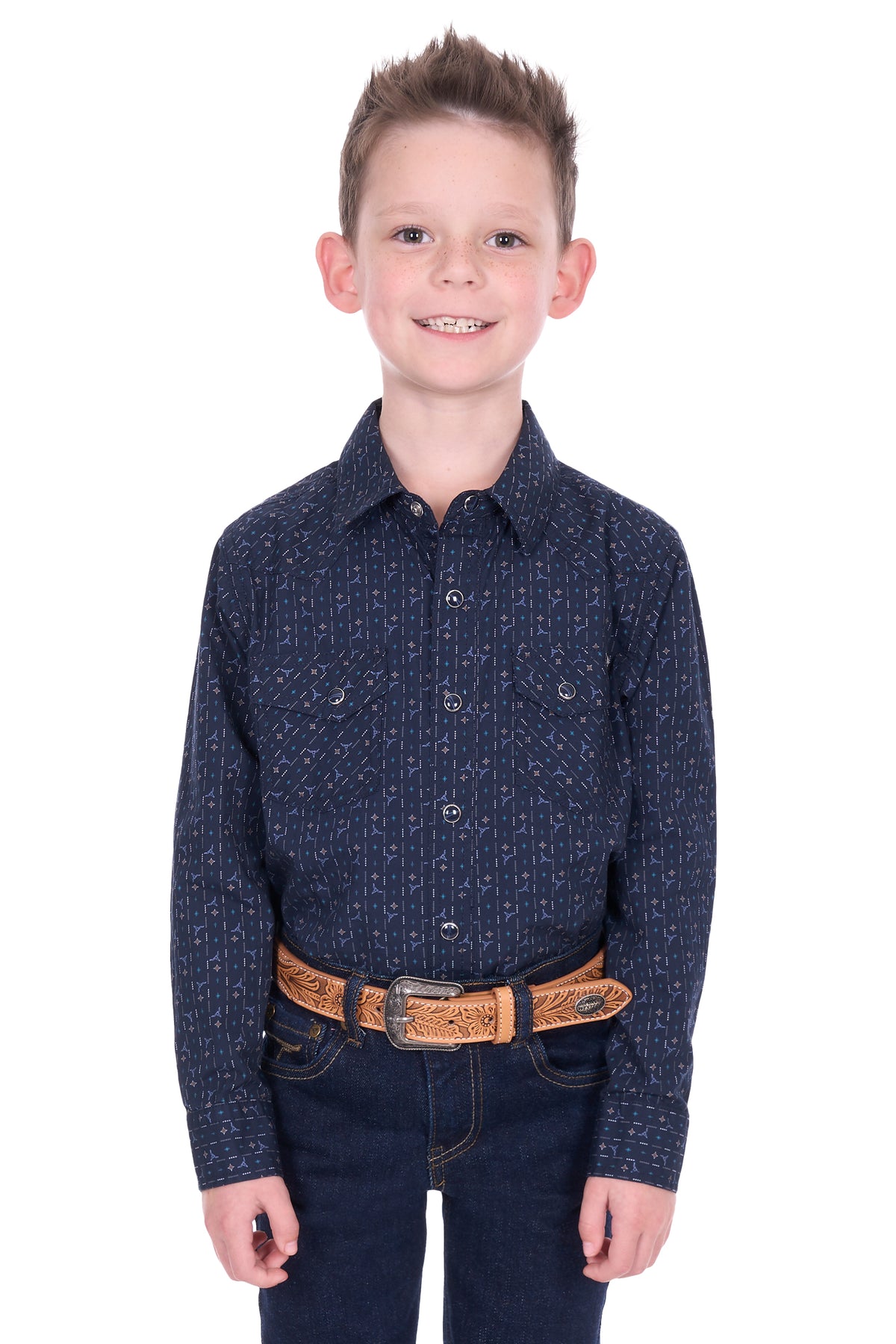 Young boy wearing a dark blue patterned shirt and jeans on a white background