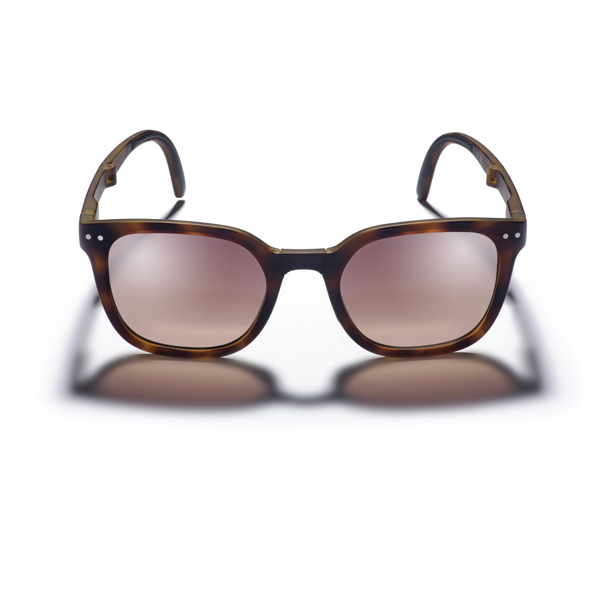 Sunglasses with tortoiseshell frame and brown lenses on a white background