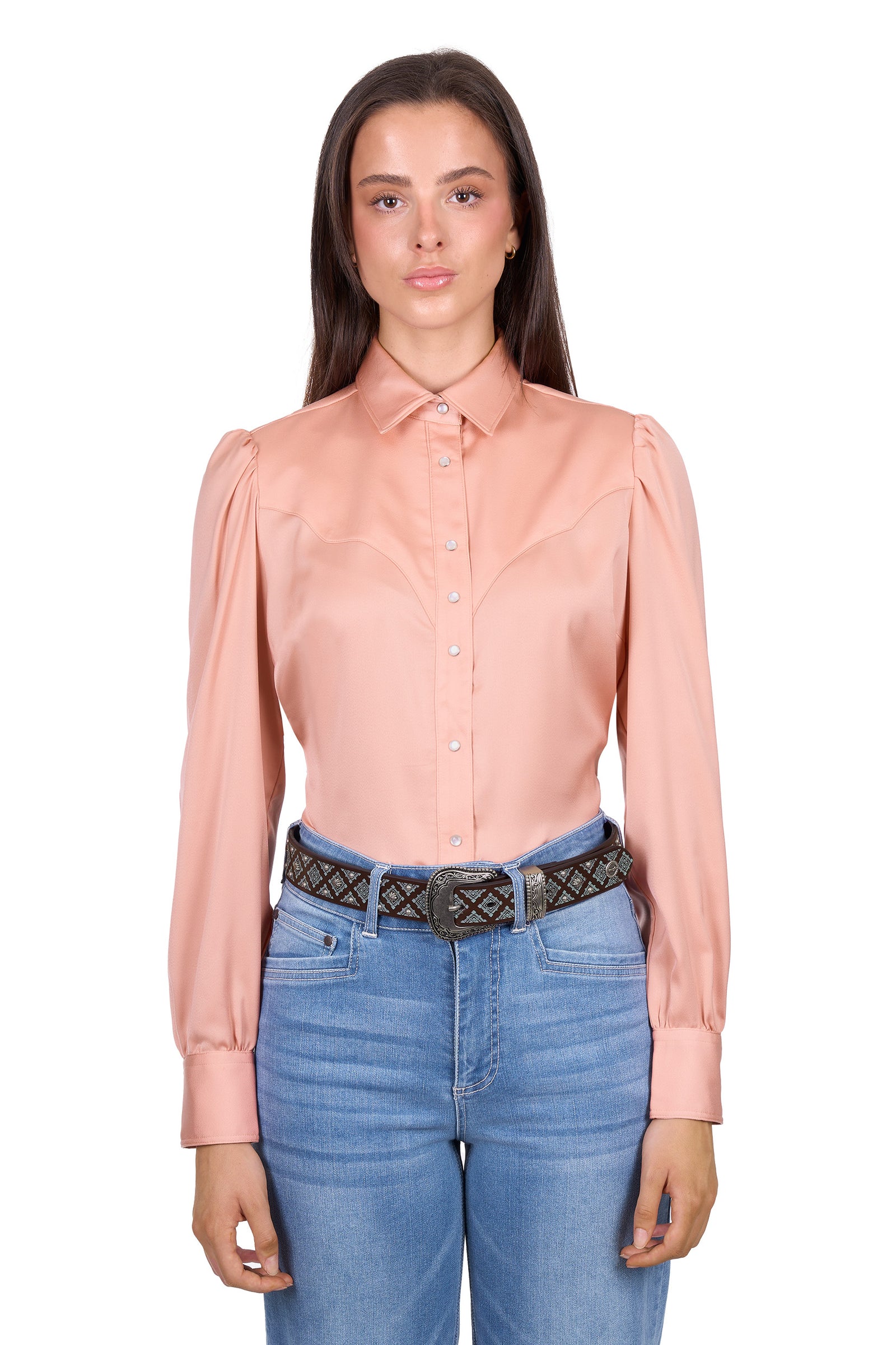 Woman wearing a light pink blouse and blue jeans on a white background