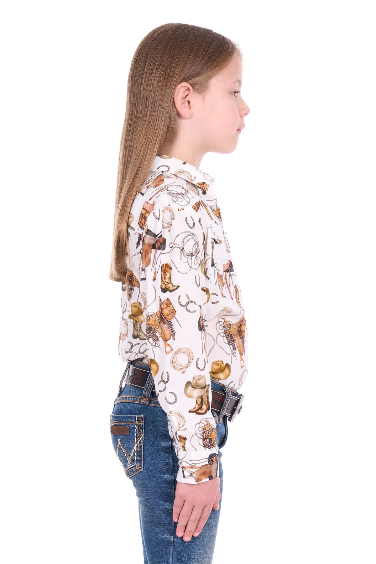 Girl wearing a patterned shirt with cowboy design on a white background