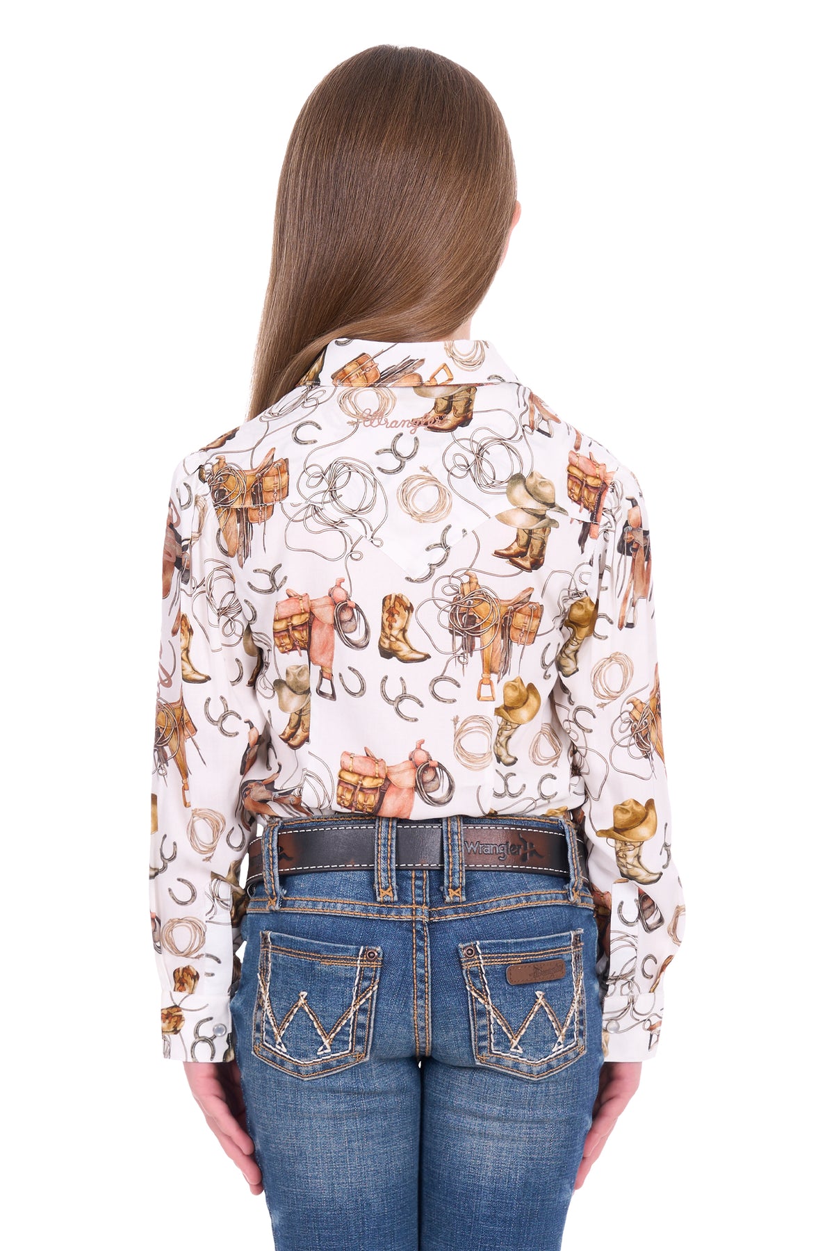 Person wearing a patterned shirt with cowboy designs and blue jeans on a white background