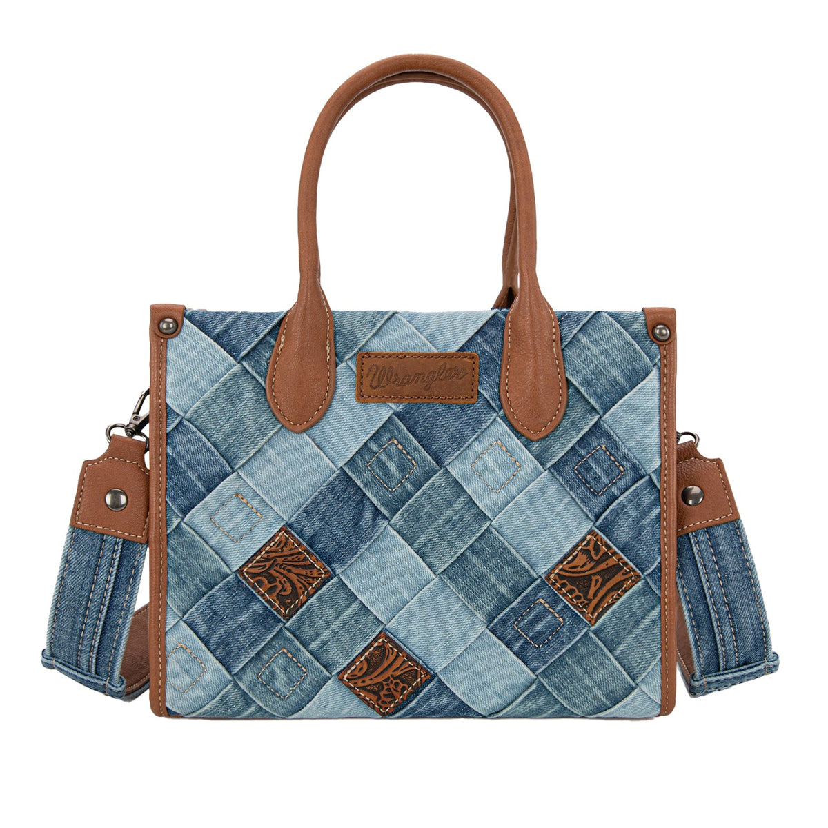 Denim patchwork handbag with brown leather accents on a white background