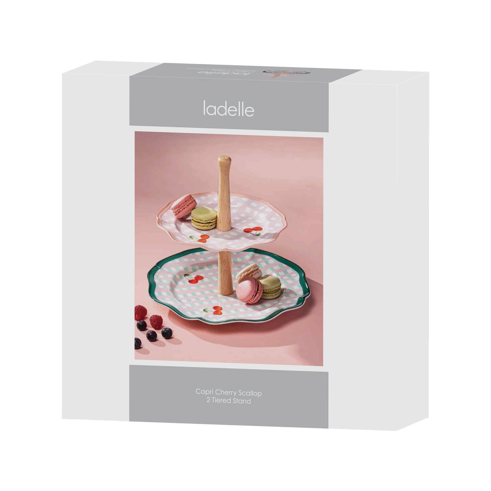 Ladelle Capri Cherry Scallop 2 Tier Stand. Ladelle two-tiered stand with macaron figurines in a box on a white background