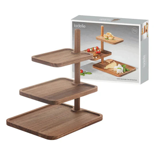 Ladelle Gather Rectangle 3 Tier Serving Tower. Wooden serving tray with food items and Ladelle packaging on a white background