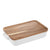 Ladelle Alto Oven To Table Lge Baking Dish with Lid/Trivet. White rectangular ceramic dish with a wooden cutting board on a white background
