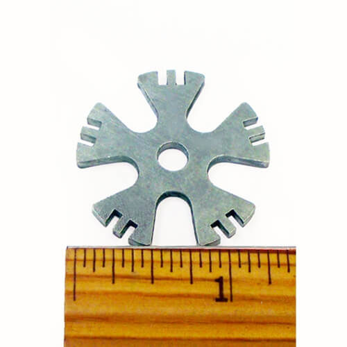 Barstow Superior Bull Riding Rowels. A metal bull riding rowel alongside a wooden ruler for scale.