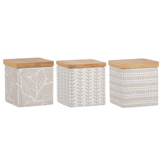 Orion White Assorted Canister- Set of 3. Three storage canisters with leaf patterns and wooden lids on a white background