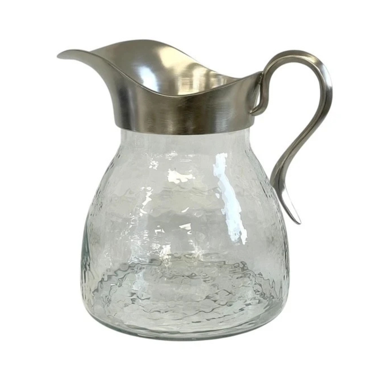 A clear glass pitcher with a hammered texture, featuring a brushed silver metal rim and a matching curved handle, set against a plain white background.