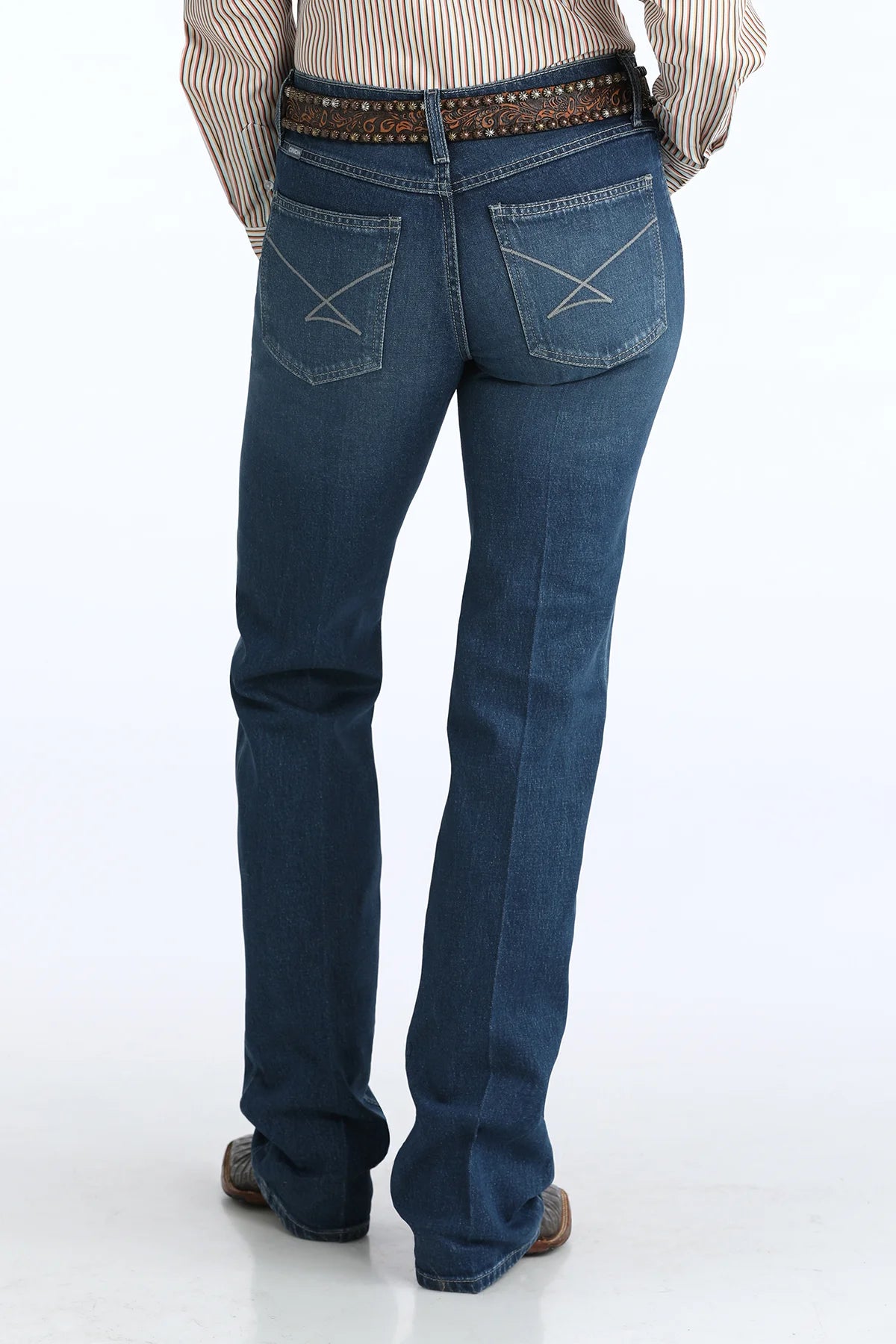 Person wearing blue jeans on a white background