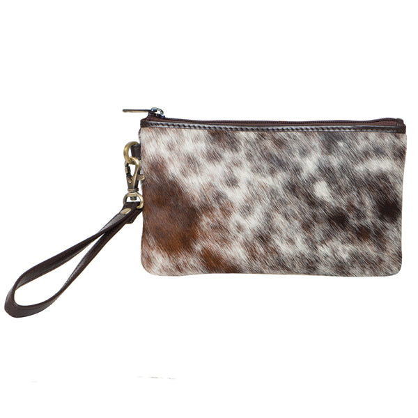 Women's Toronto Small Cowhide Clutch. Cow print clutch bag with a strap on a white background