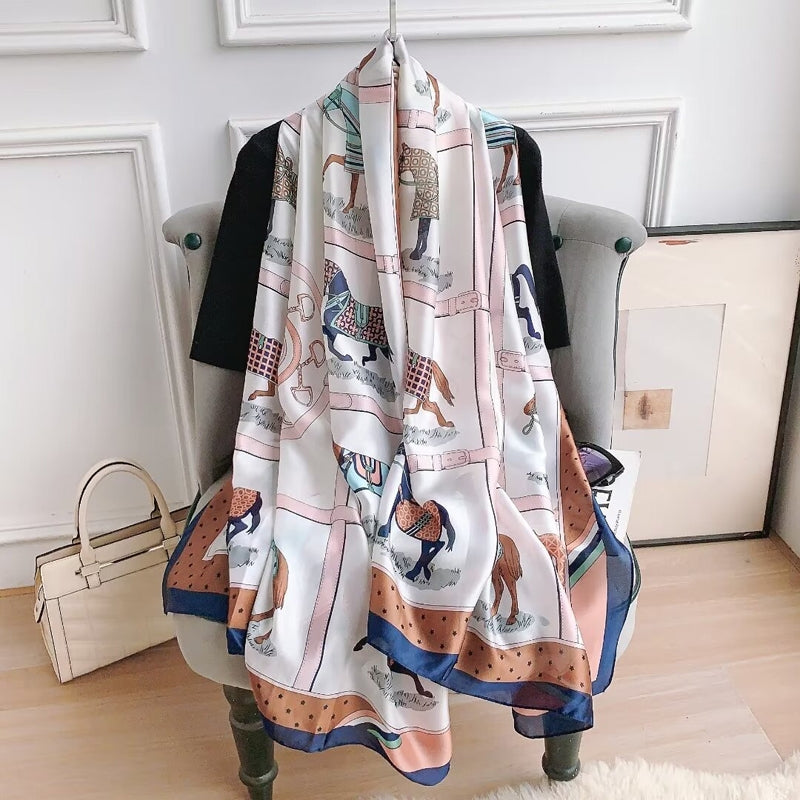 Classic Designer Horse Silk Scarf. Scarf with horse print draped over a chair in a room.