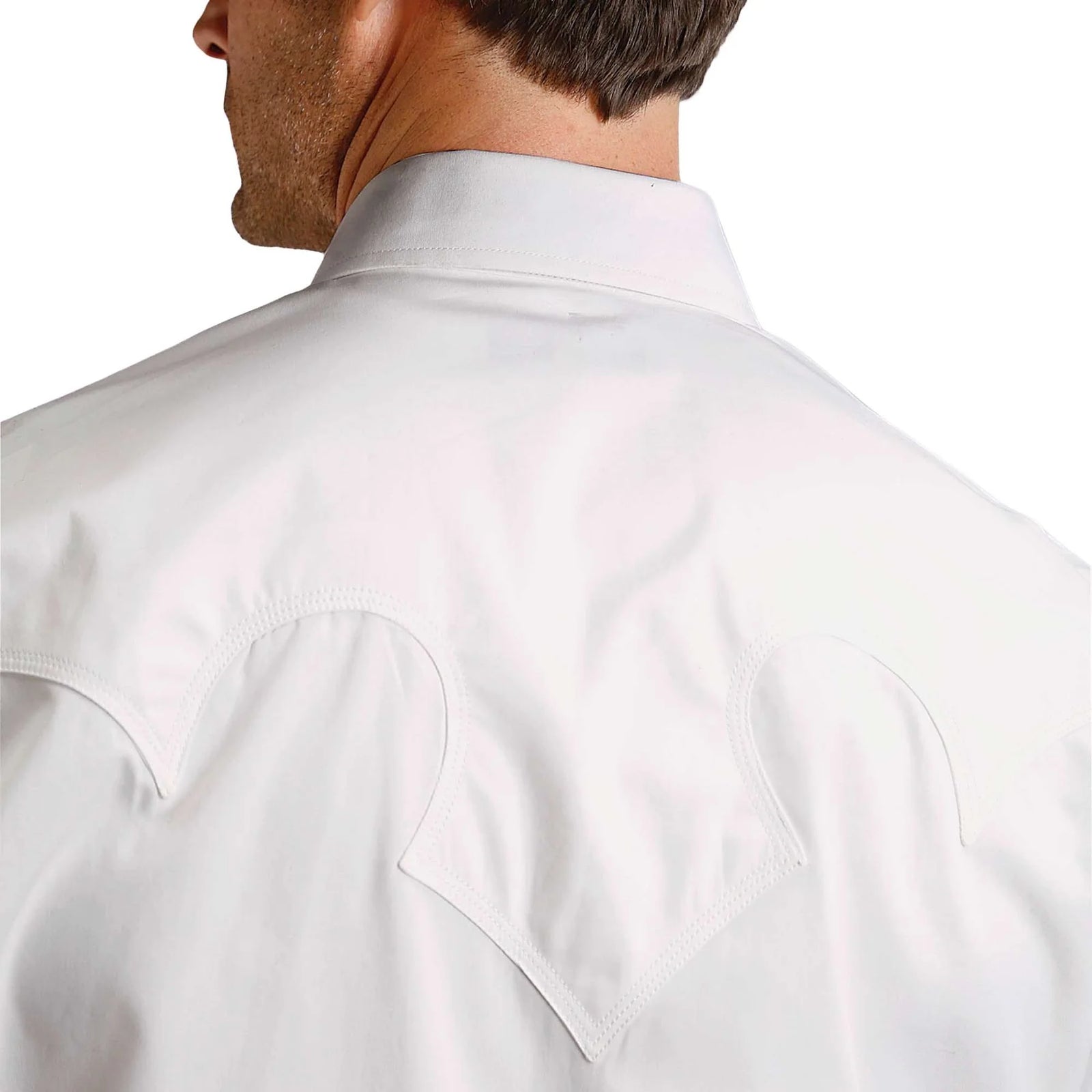 Close-up of a white dress shirt on a white background