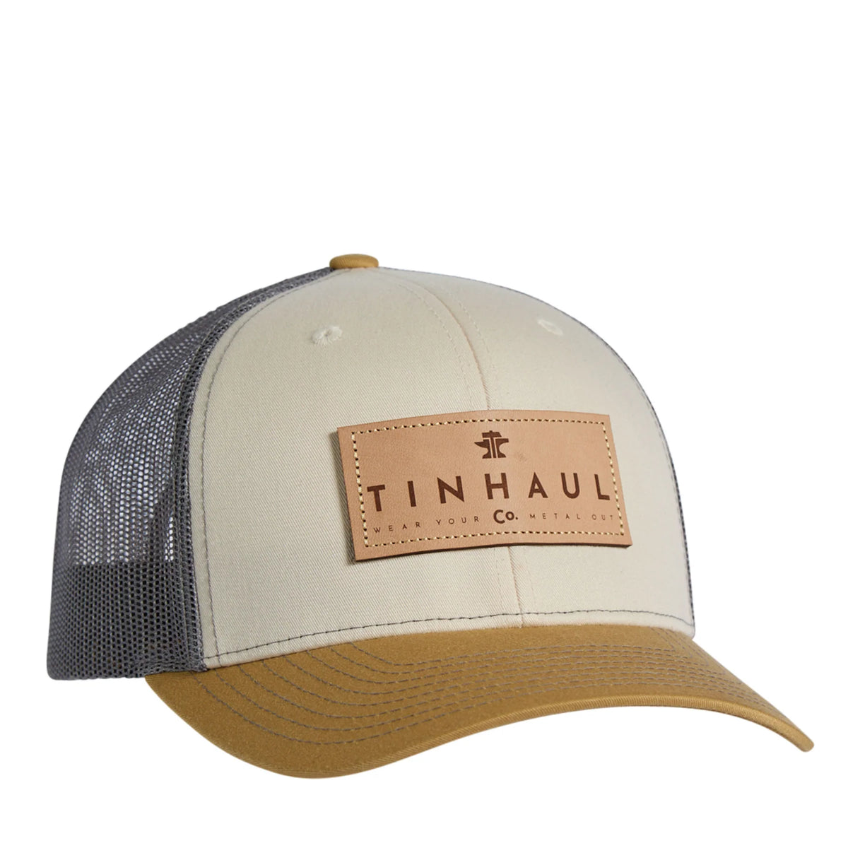 Trucker hat with beige front panel, blue mesh back, and brown brim featuring Tin haul logo.