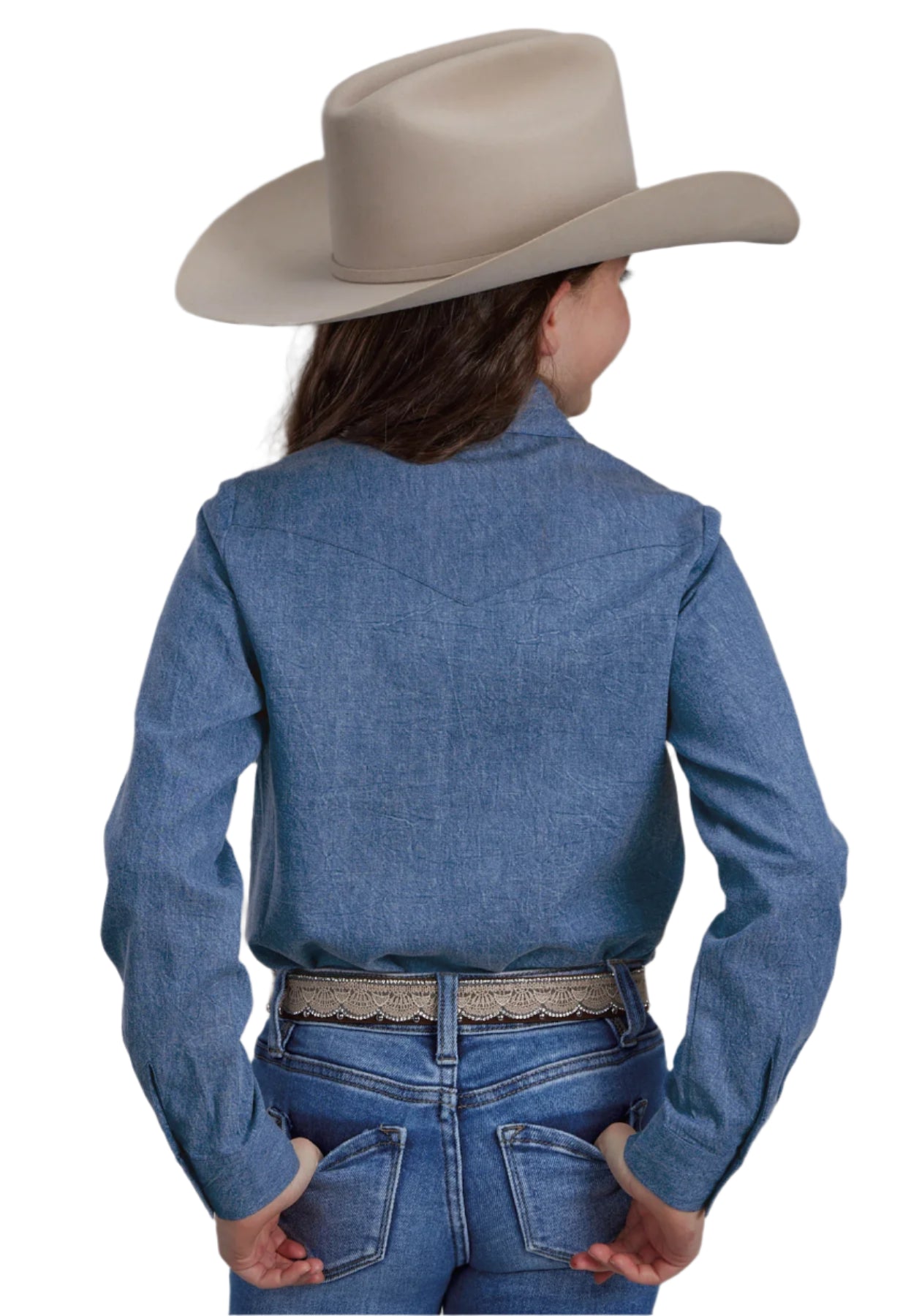 Roper Girl's Five Star Collection L/S Shirt. A girl wearing a long sleeve blue denim shirt with embroidery, buttoned all the way down the front, paired with blue jeans and a wide-brimmed hat.