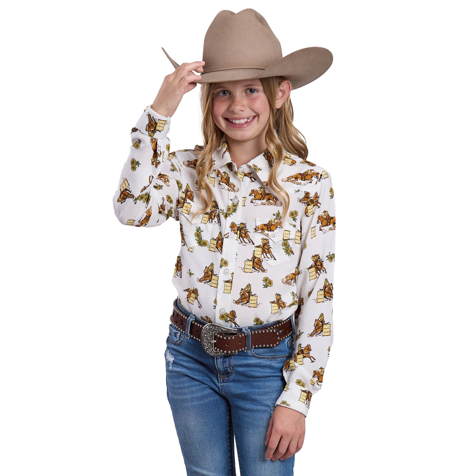 Young girl wearing a white shirt with cowboy print, blue jeans, and a tan cowboy hat on a white background