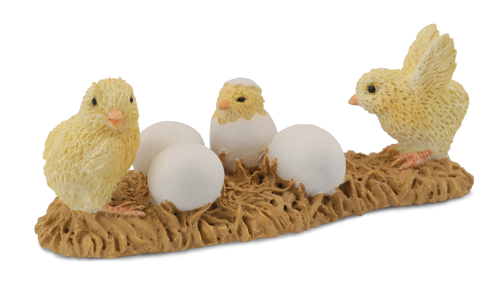Three toy chicks with eggs on a brown base against a white background
