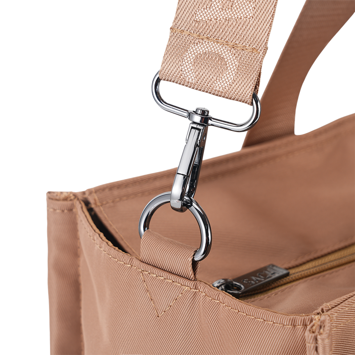 Close-up of a tan woven shoulder strap with a silver metal clasp attached to a matching tan bag, showing part of the zipper and a small visible brand tab.