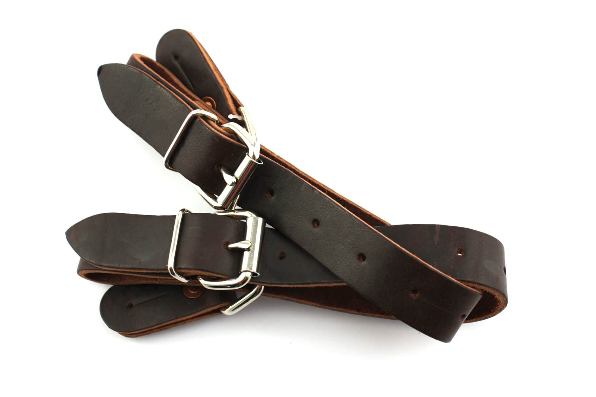 Barstow Bareback & Bull Spur Straps. A pair of brown leather bareback and bull spur straps with metal buckles.