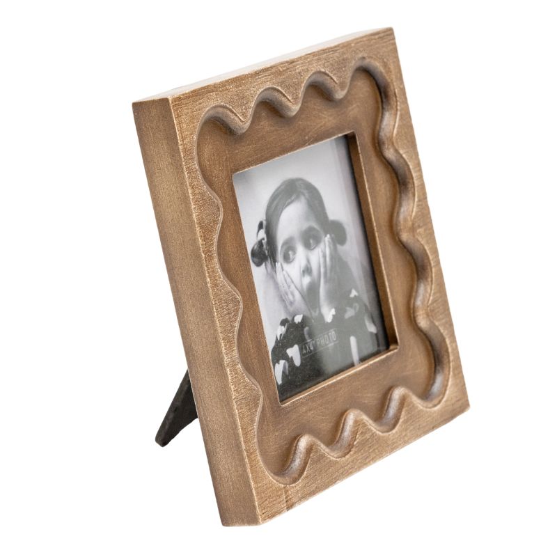 Designer Photo Frame. Wooden photo frame with a vintage-style black and white photo of a child.
