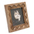 Designer Photo Frame. Wooden photo frame with a wavy edge containing a black and white photo of a child.