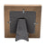 Designer Photo Frame. Wooden frame with a black metal bracket on a white background