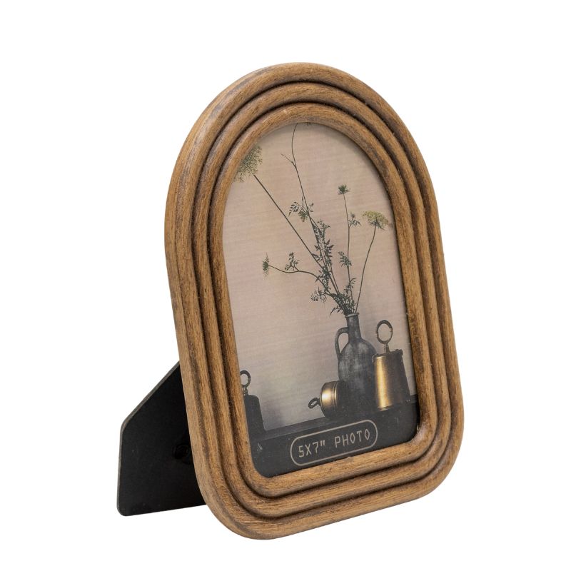 5×7″ Contemporary Arch Style Photo Frame. Wooden photo frame with a decorative interior featuring a vase and plants on a white background