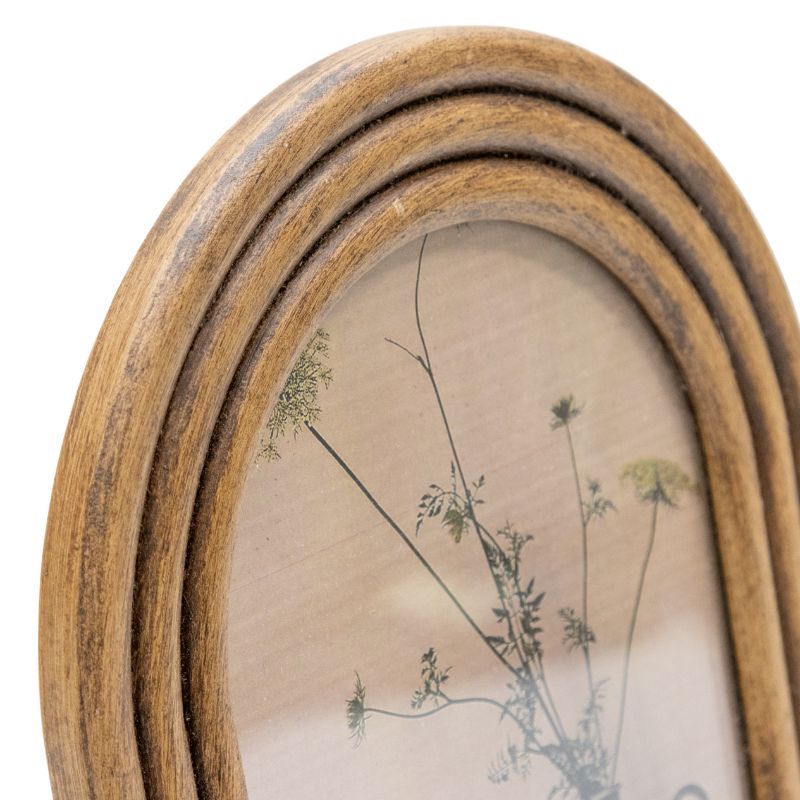 5×7″ Contemporary Arch Style Photo Frame. Wooden oval frame with a floral print on a white background