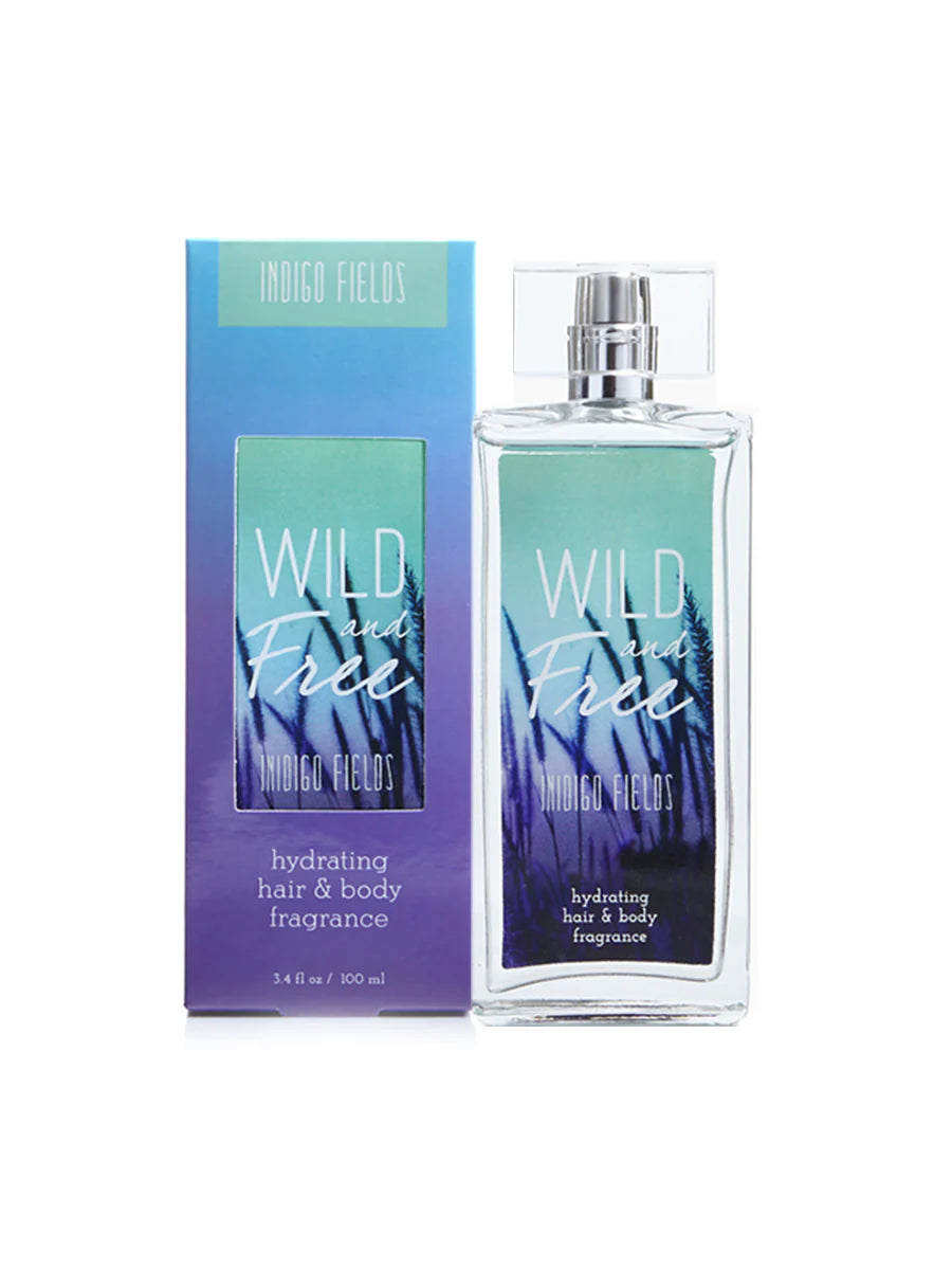 A bottle of Tru Western Women's Wild & Free Indigo Fields fragrance with its packaging box. The bottle is clear with a blue liquid inside, and the packaging has a similar color scheme.
