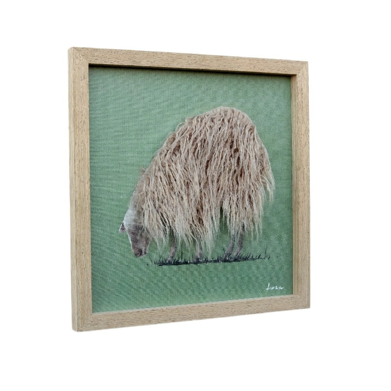 Long-Haired Sheep Hand-Made Framed Canvas Wall Art. Framed artwork of a sheep on a green background